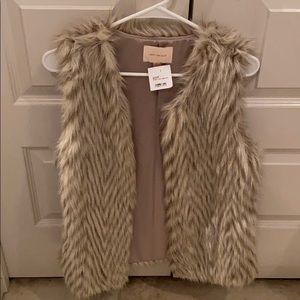 Cute faux fur vest.